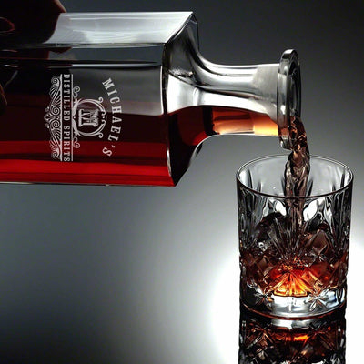 carson decanter pouring whiskey on a glass