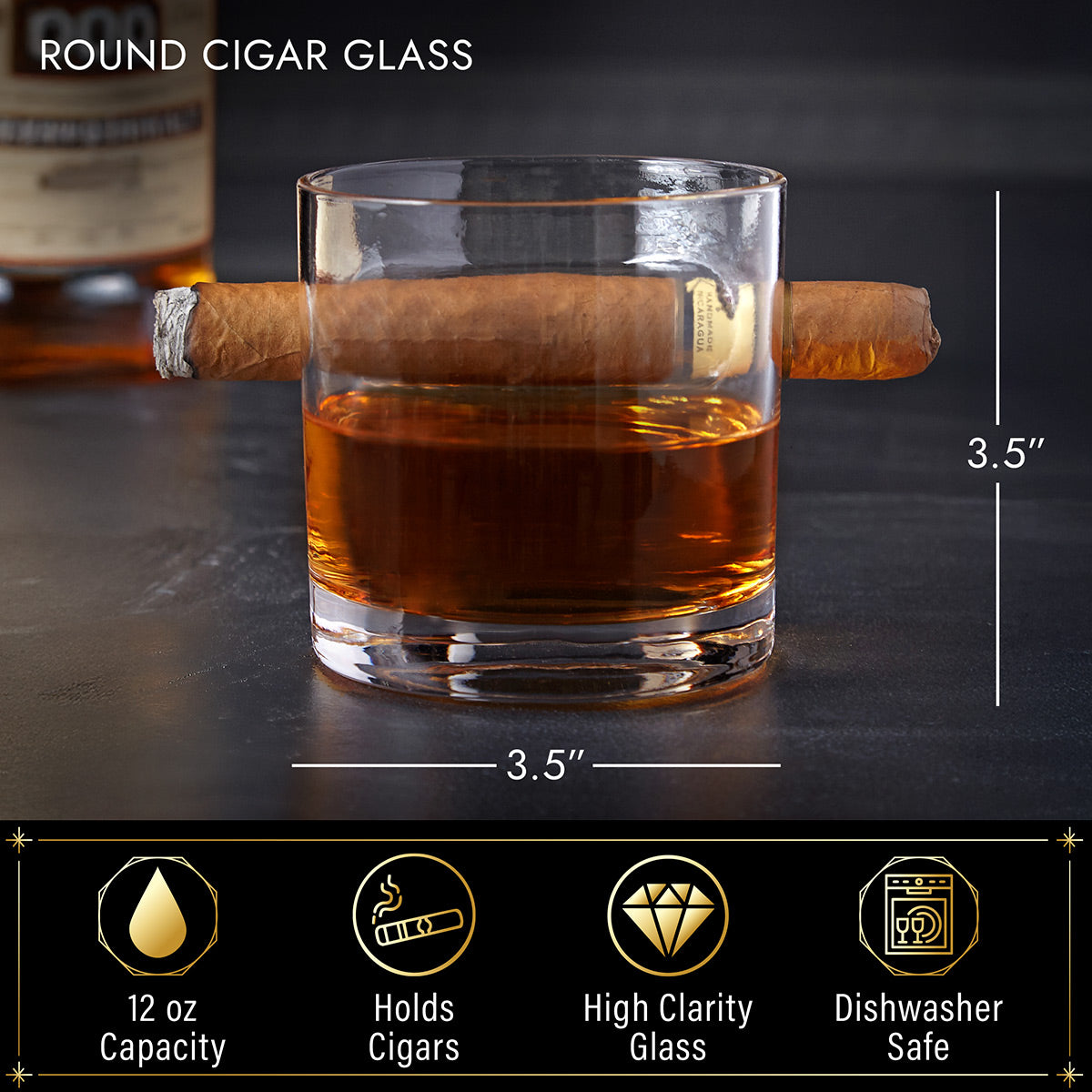 Whiskey glass with cigar resting in built-in slot; labeled 3.5 in tall and wide, 12 oz capacity, dishwasher safe icons.