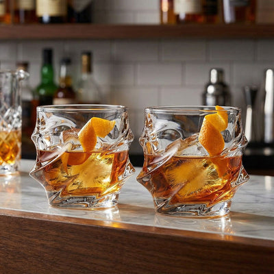 2 sculpted glasses with liquor inside
